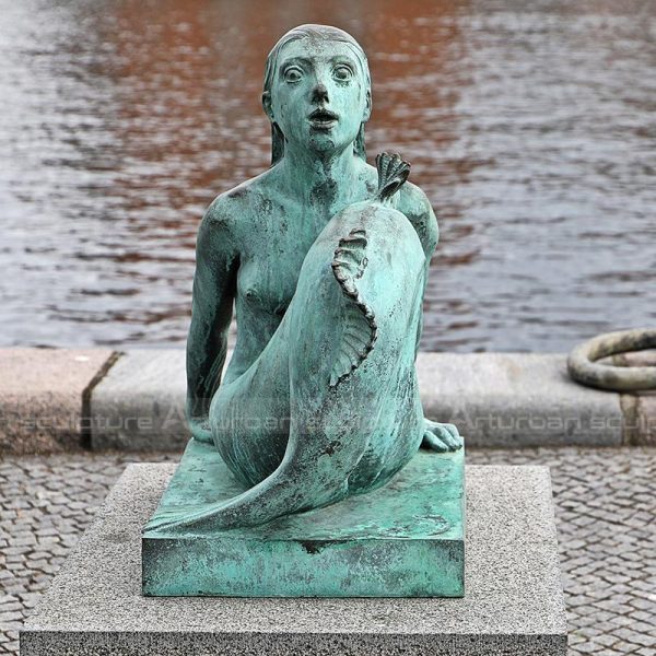 poolside mermaid statue