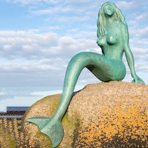 mermaid on rock statue