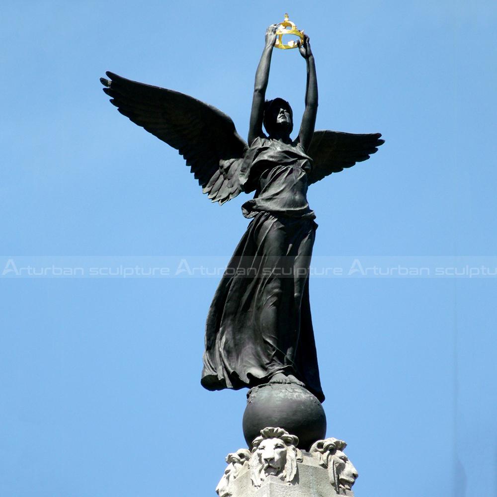 angel on ball statue