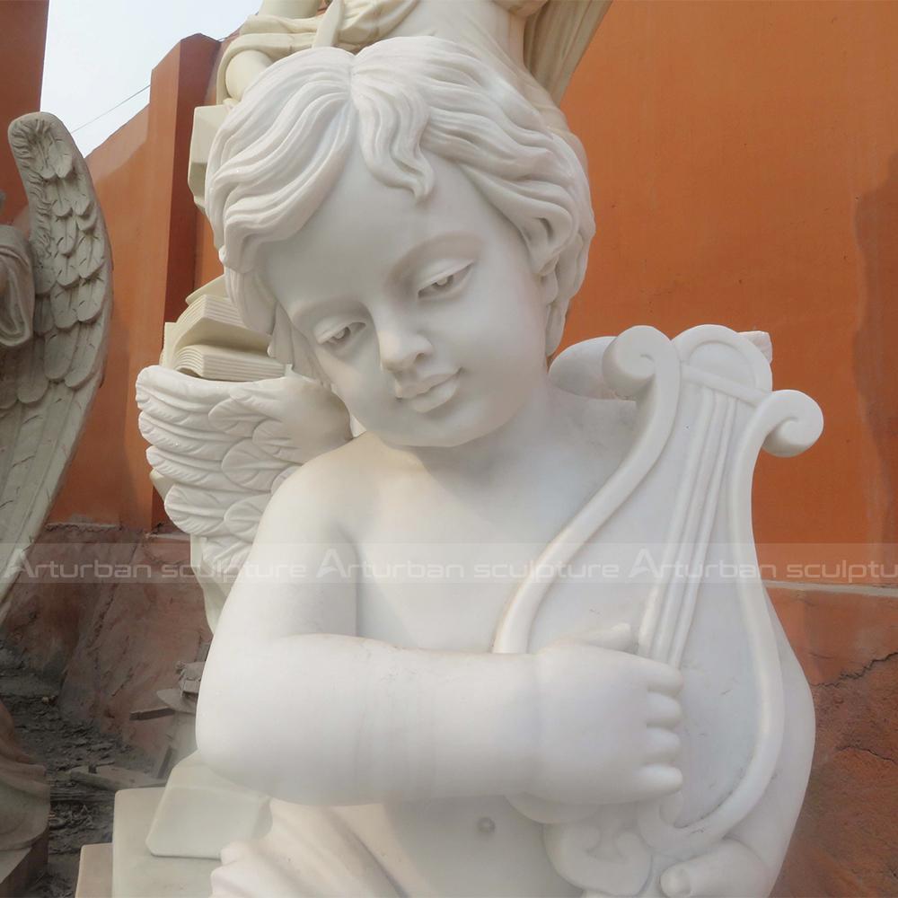 cherub statue with guitar