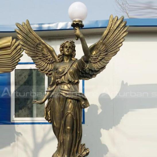 Greek goddess garden statues is a classic sculpture of a Greek goddess holding a guiding light in her hand. The elegant and beautiful angel holds a light