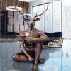 bronze deer man statue