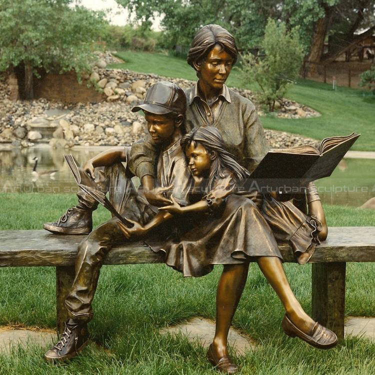 Mother and children reading sculpture
