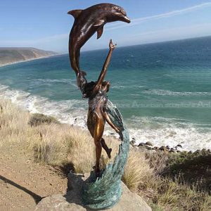 girl and dolphin pool sculpture