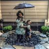 boy and girl under umbrella fountain