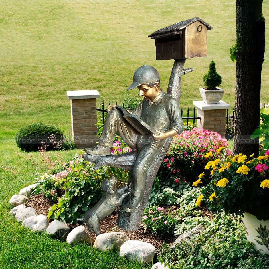 mailbox boy reading book sculpture