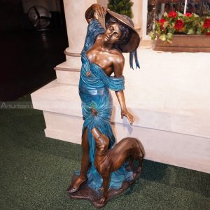 woman and dog sculpture