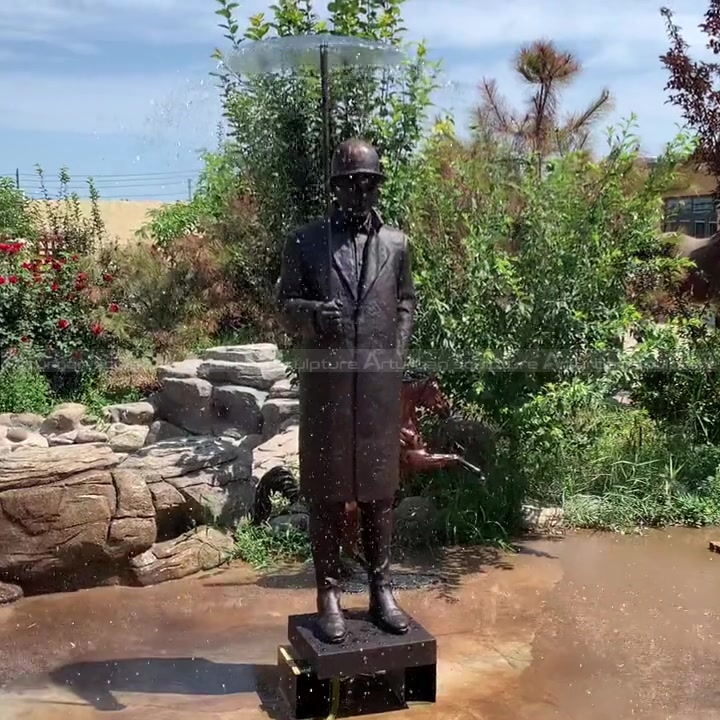 man statue with umbrella fountain