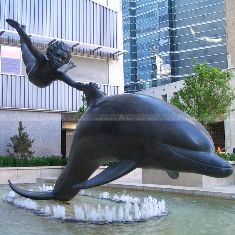 dolphin and boy statue