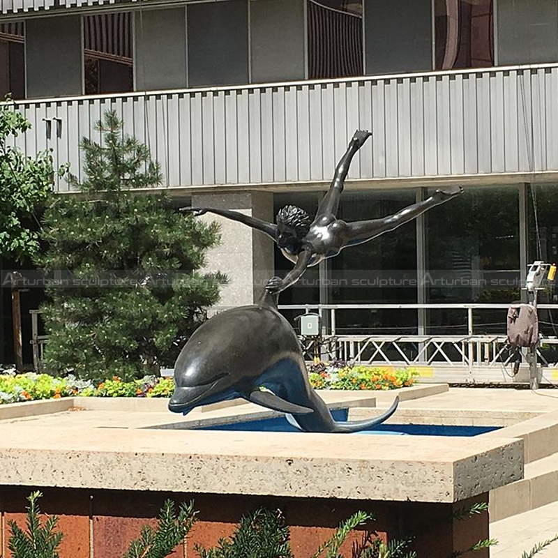 dolphin and boy statue