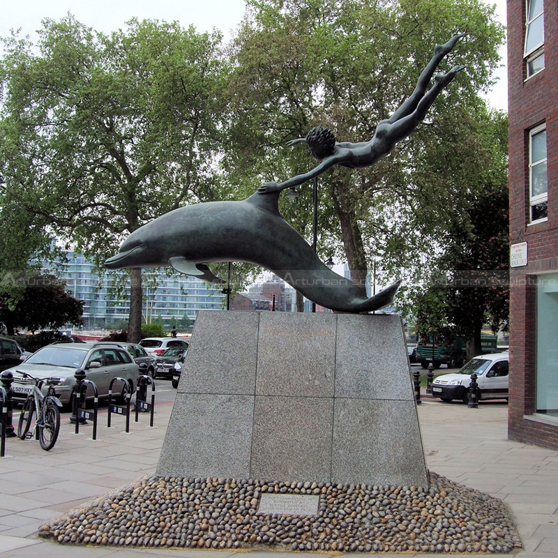 dolphin and boy statue