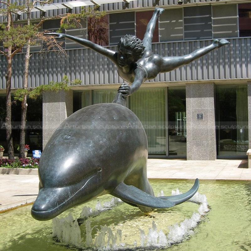 dolphin and boy statue