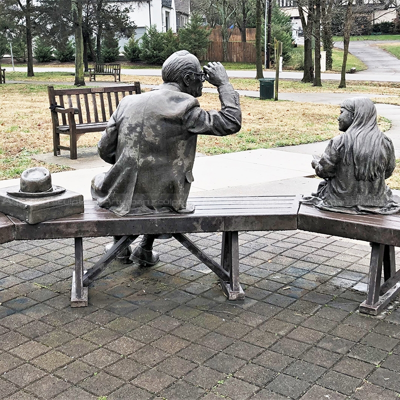 grandfather and granddaughter statue