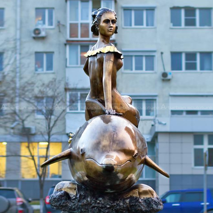 woman with dolphin statue