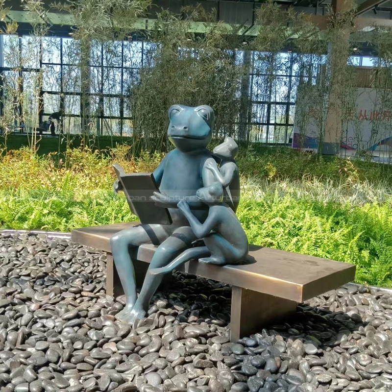 reading frog family garden sculpture
