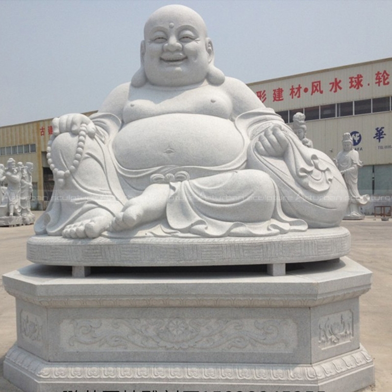 white laughing buddha statue