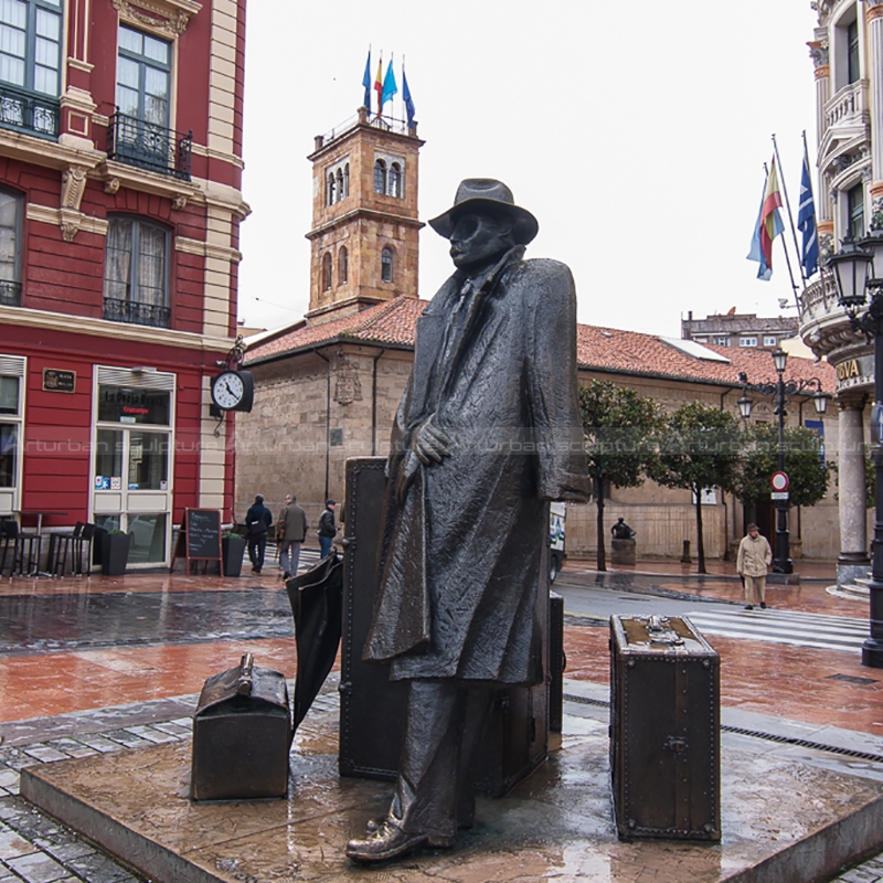 man with suitcase sculpture