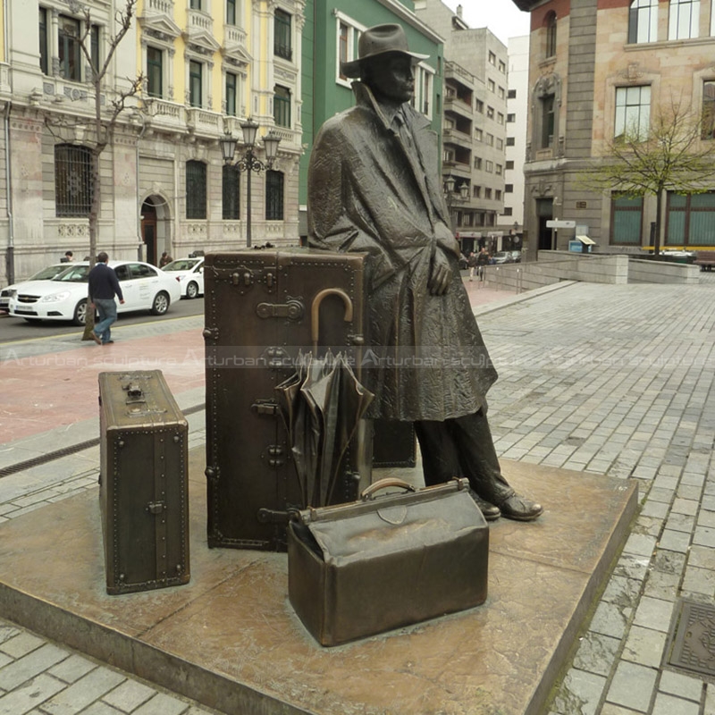 man with suitcase sculpture