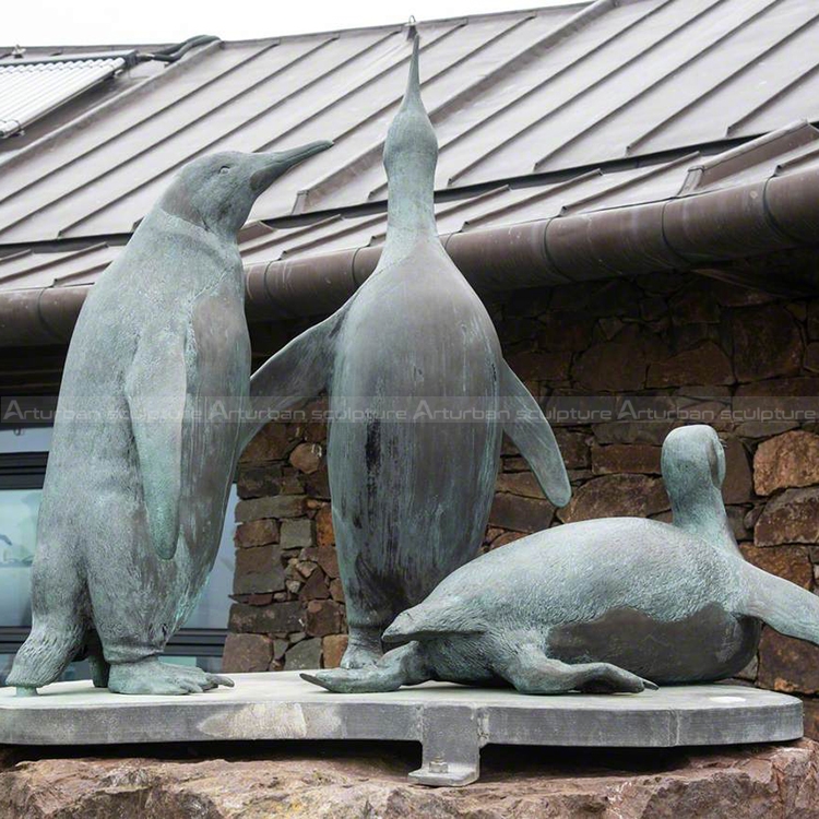 bronze penguin sculpture