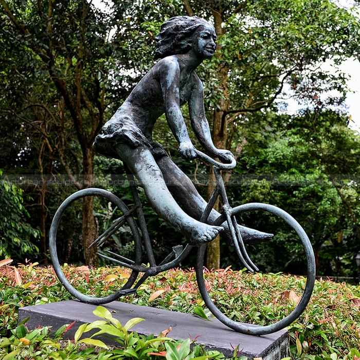 girl on bicycle sculpture