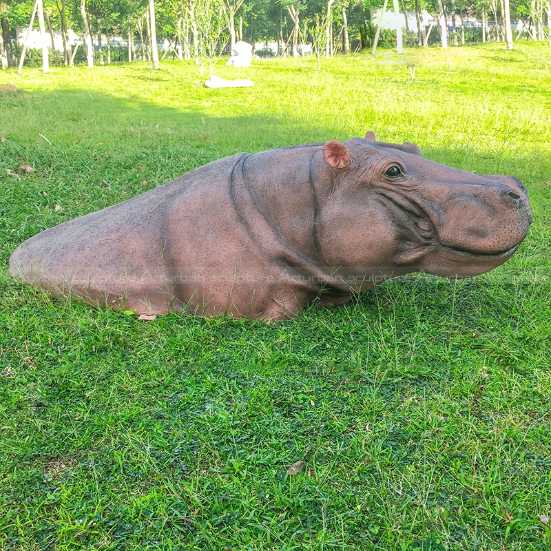 swimming hippo garden sculpture