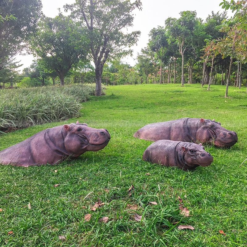 swimming hippo garden sculpture