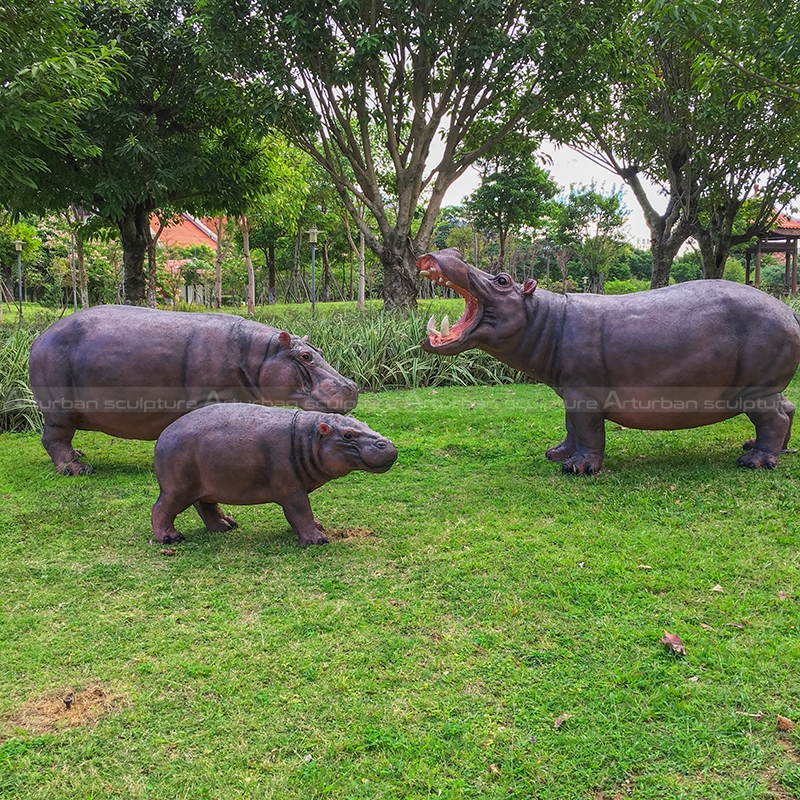 swimming hippo garden sculpture
