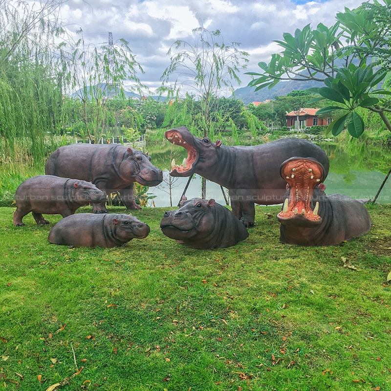 swimming hippo garden sculpture