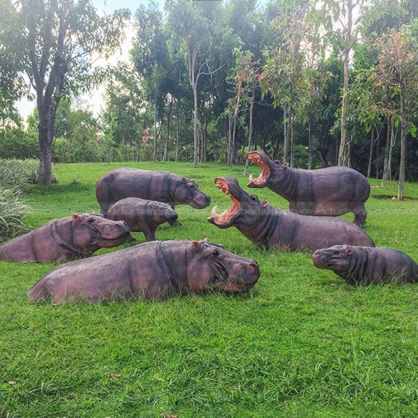 swimming hippo garden sculpture