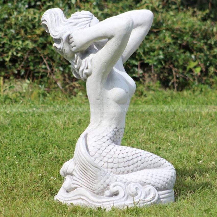 stone mermaid statue