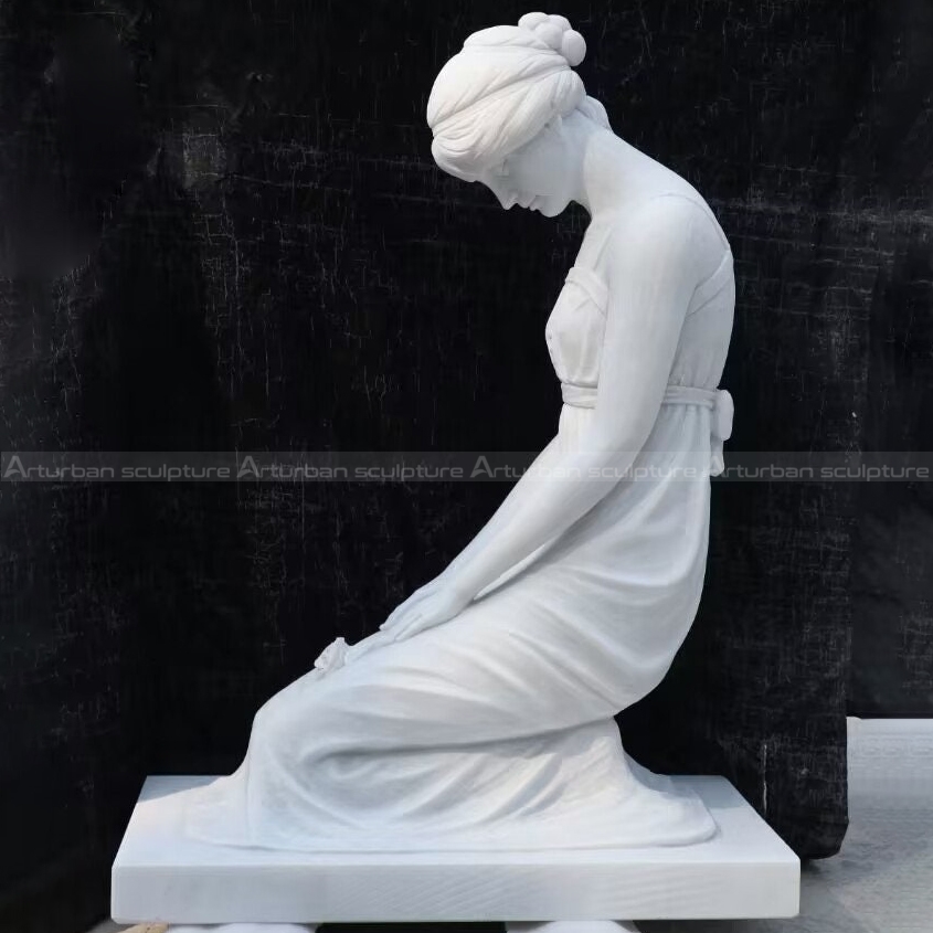 kneeling woman statue