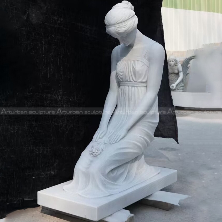 kneeling woman statue