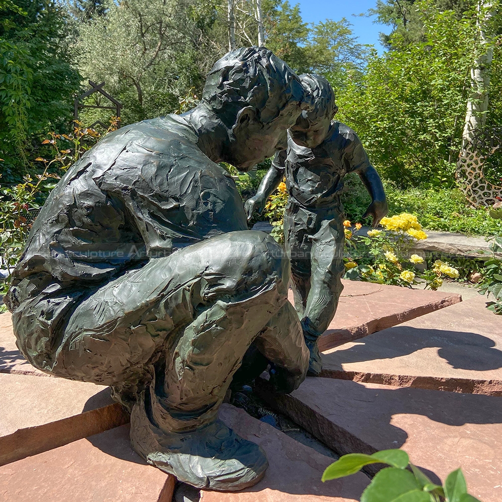 father and child sculpture