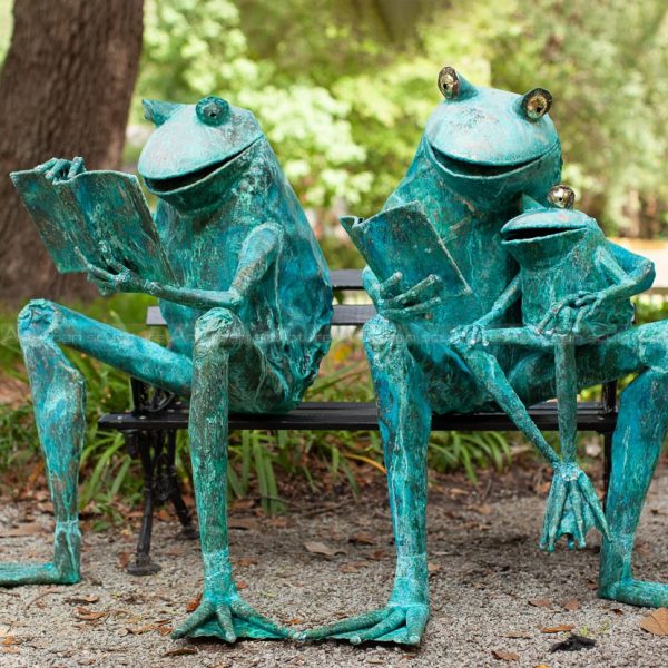 reading frog statue