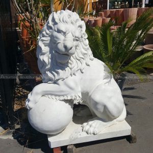 lion holding ball statue