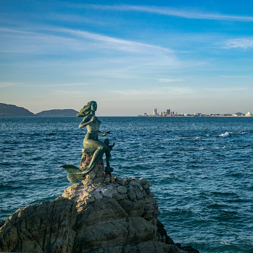 large bronze mermaid statue