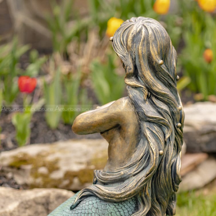 mermaid on a rock sculpture