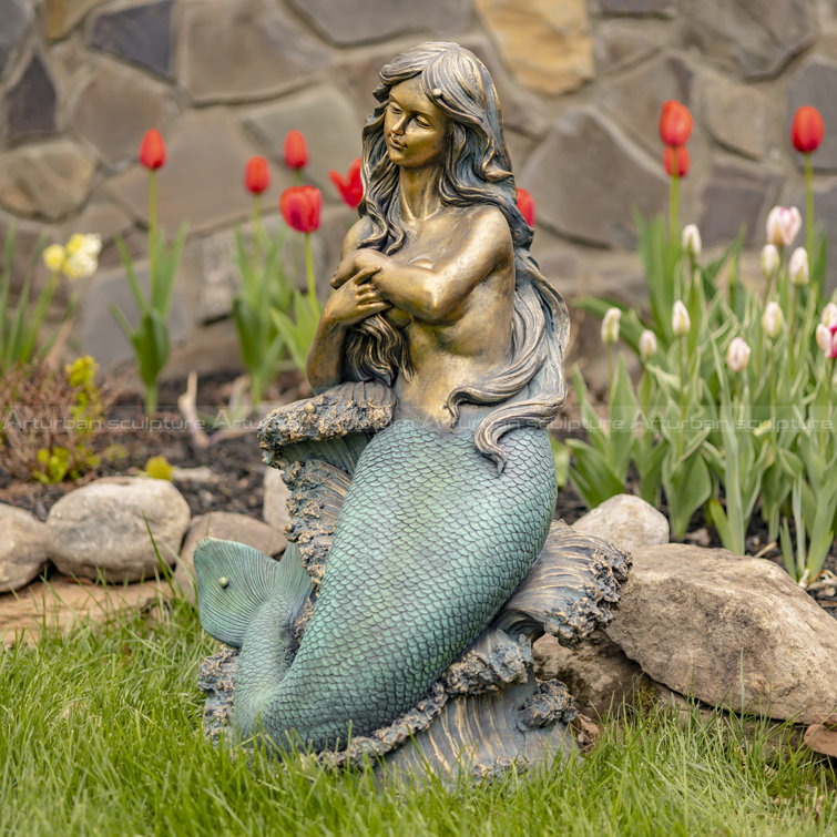 mermaid on a rock sculpture