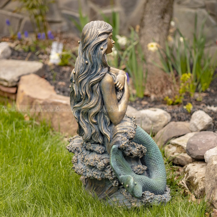 mermaid on a rock sculpture