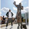 bronze football player statue