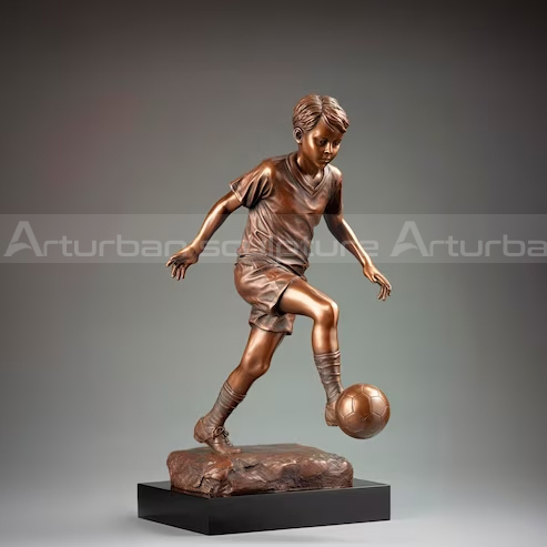 soccer player bronze statue