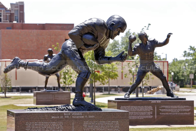 bronze football player statue