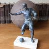 soccer player bronze statue