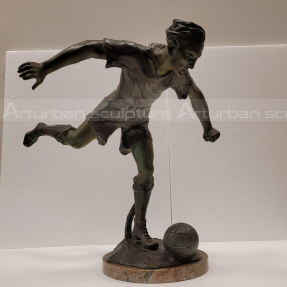 soccer player bronze statue