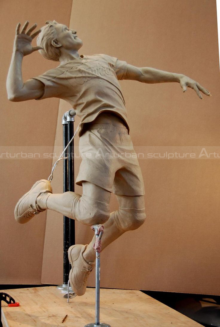 badminton player sculpture