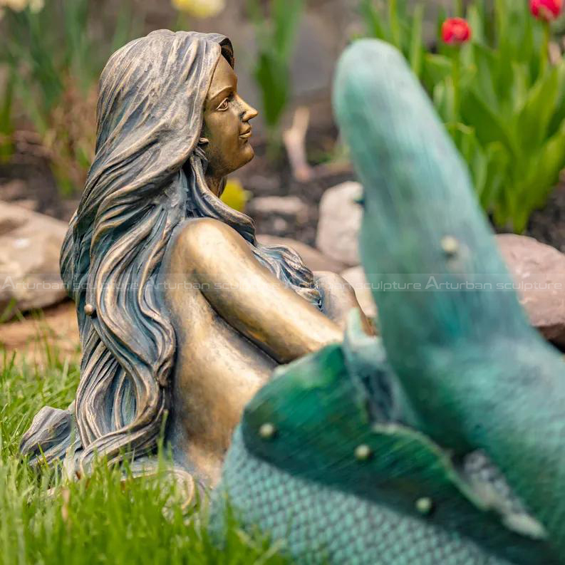 metal mermaid sculpture