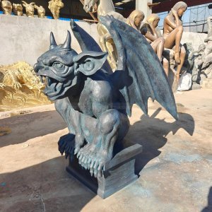 Gargoyle Lawn Statue crouching with its wings spread wide and a fierce expression