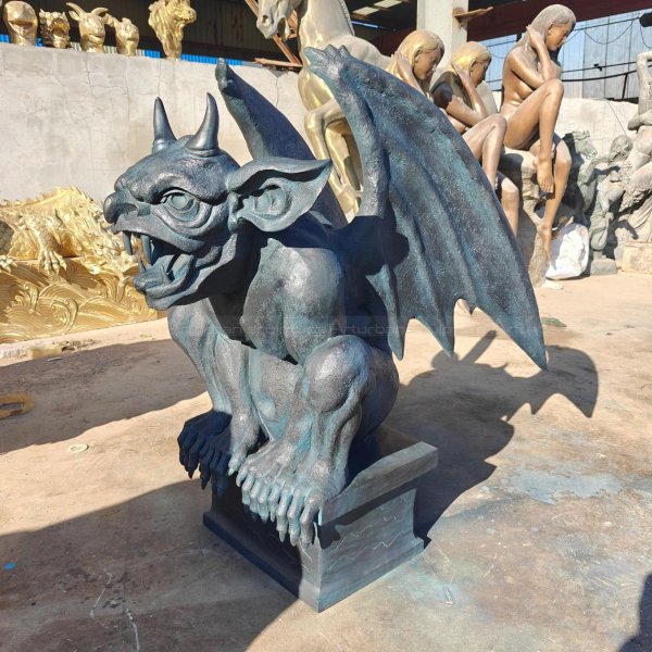 Gargoyle Lawn Statue crouching with its wings spread wide and a fierce expression