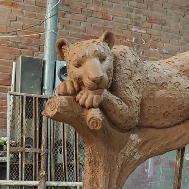Large Jaguar Statue resting on a tree