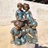 four Children Reading and interacting Statue